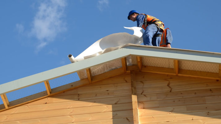 Roofing Contractor Installing a New Roof In Michigan